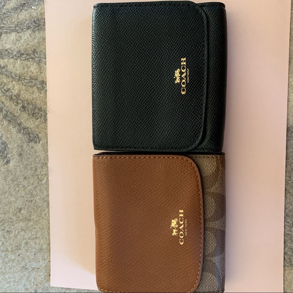 Set of two matching coach wallets